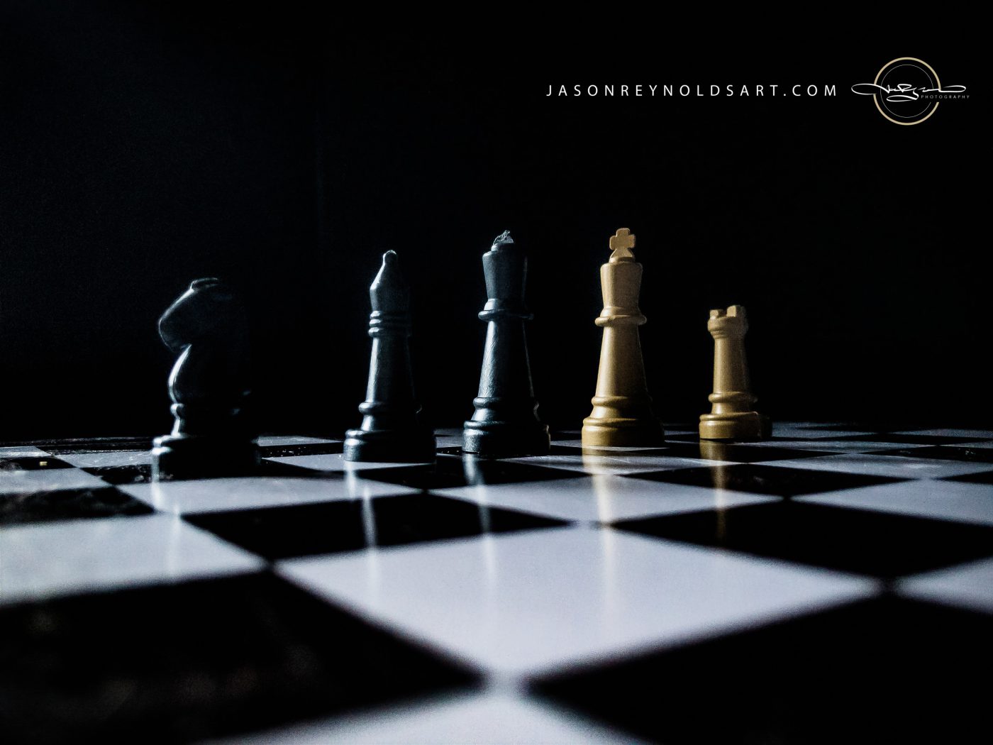 Black and Gold Chess Pieces on Chessboard