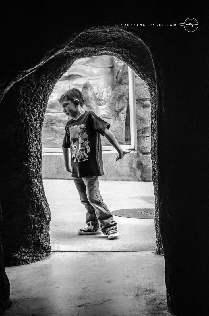 Boy in Stone Archway