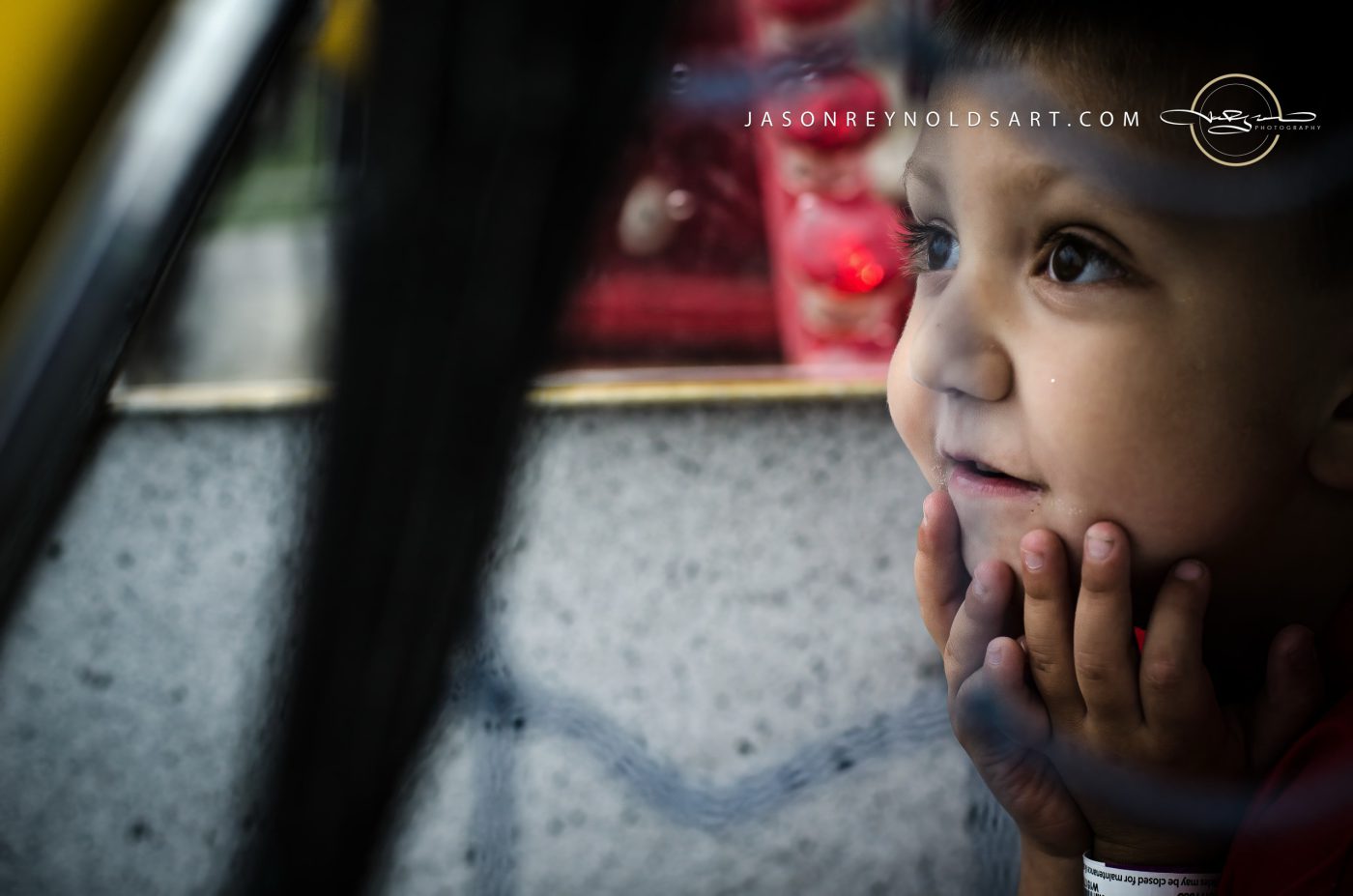 Child Pressing Face to Window