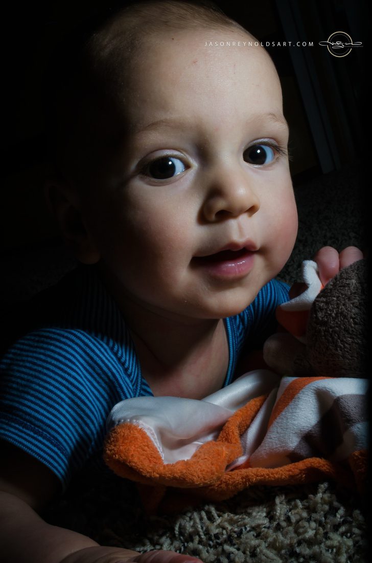 Close-up Portrait of Baby Holding Plush Security Blanket