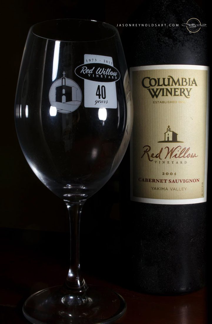 Columbia Winery bottle with empty wine glass