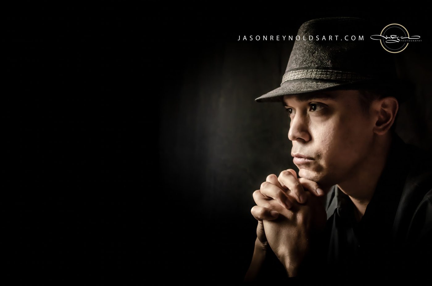 Contemplative Man in Fedora — Low‑Key Portrait
