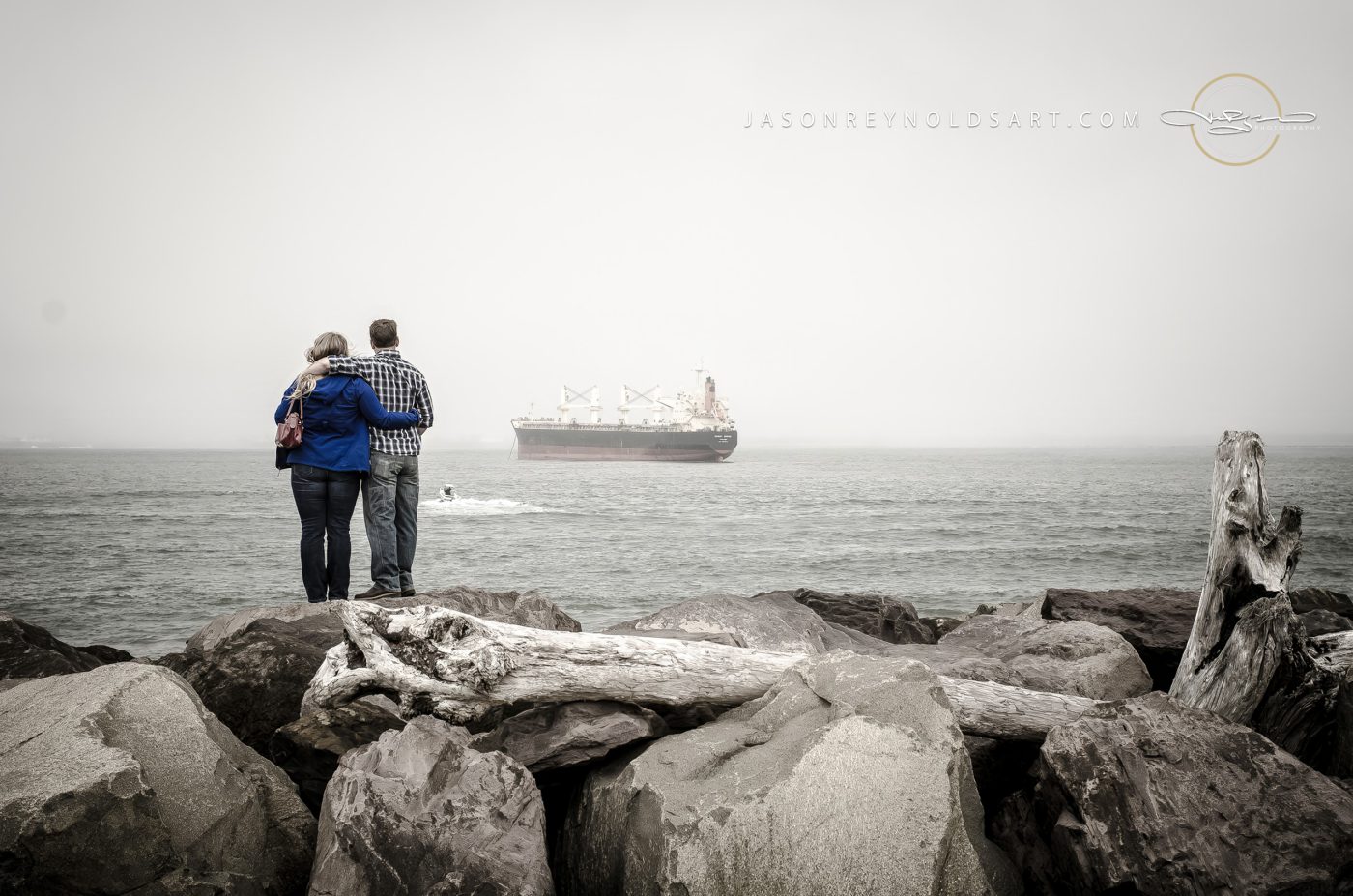 Couple on Westport Jetty Watching Cargo Ship