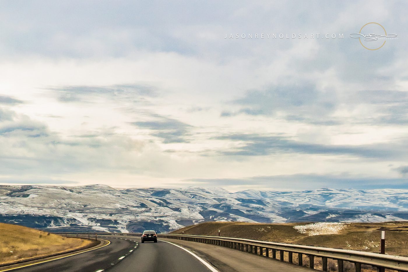 Highway into Quincy — Snow‑Dusted Rolling Hills
