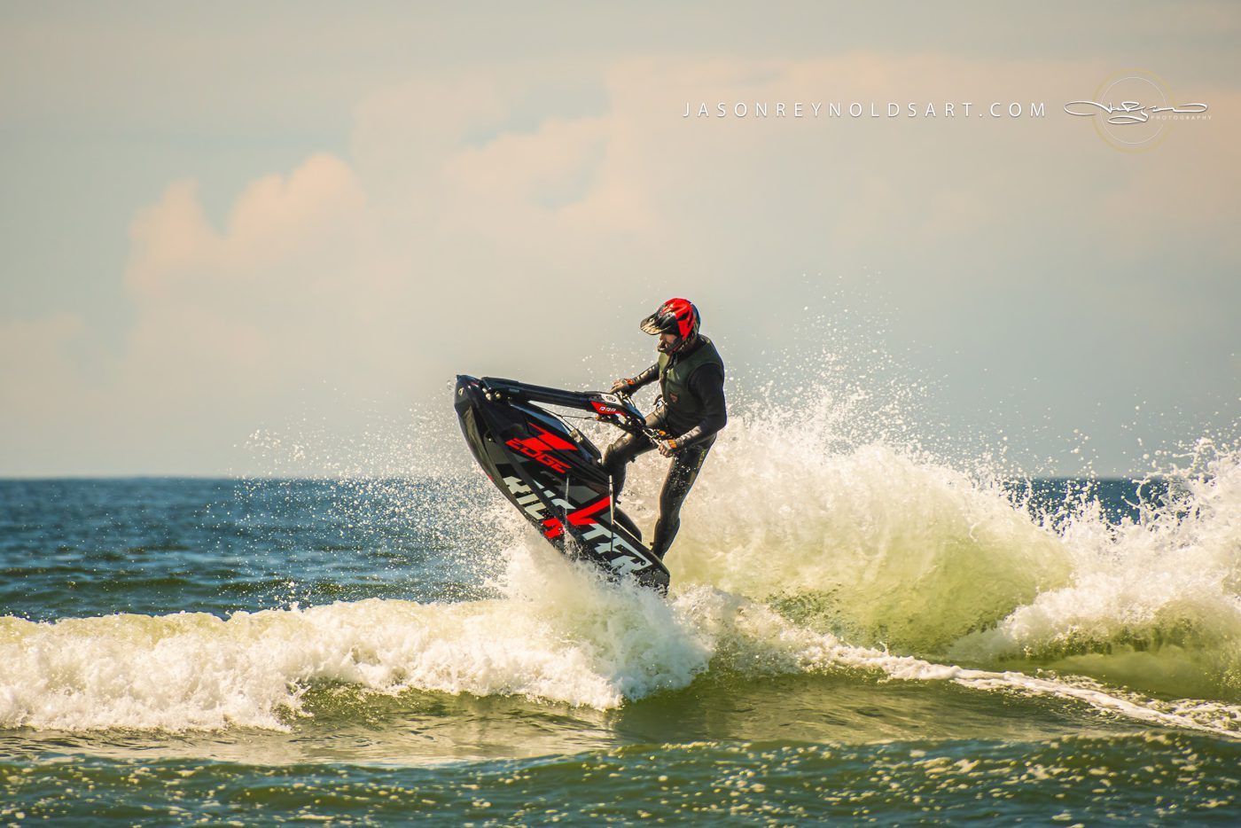 Jet Ski Rider Launching Through Ocean Spray