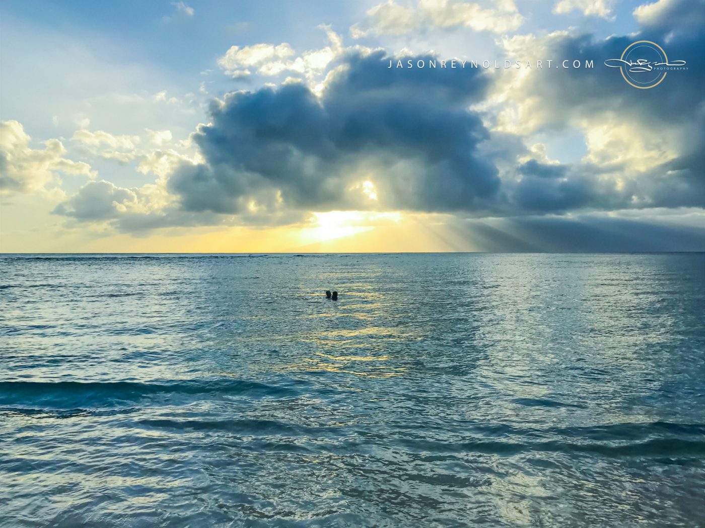 Lahaina Sunbeams and Silhouetted Swimmers