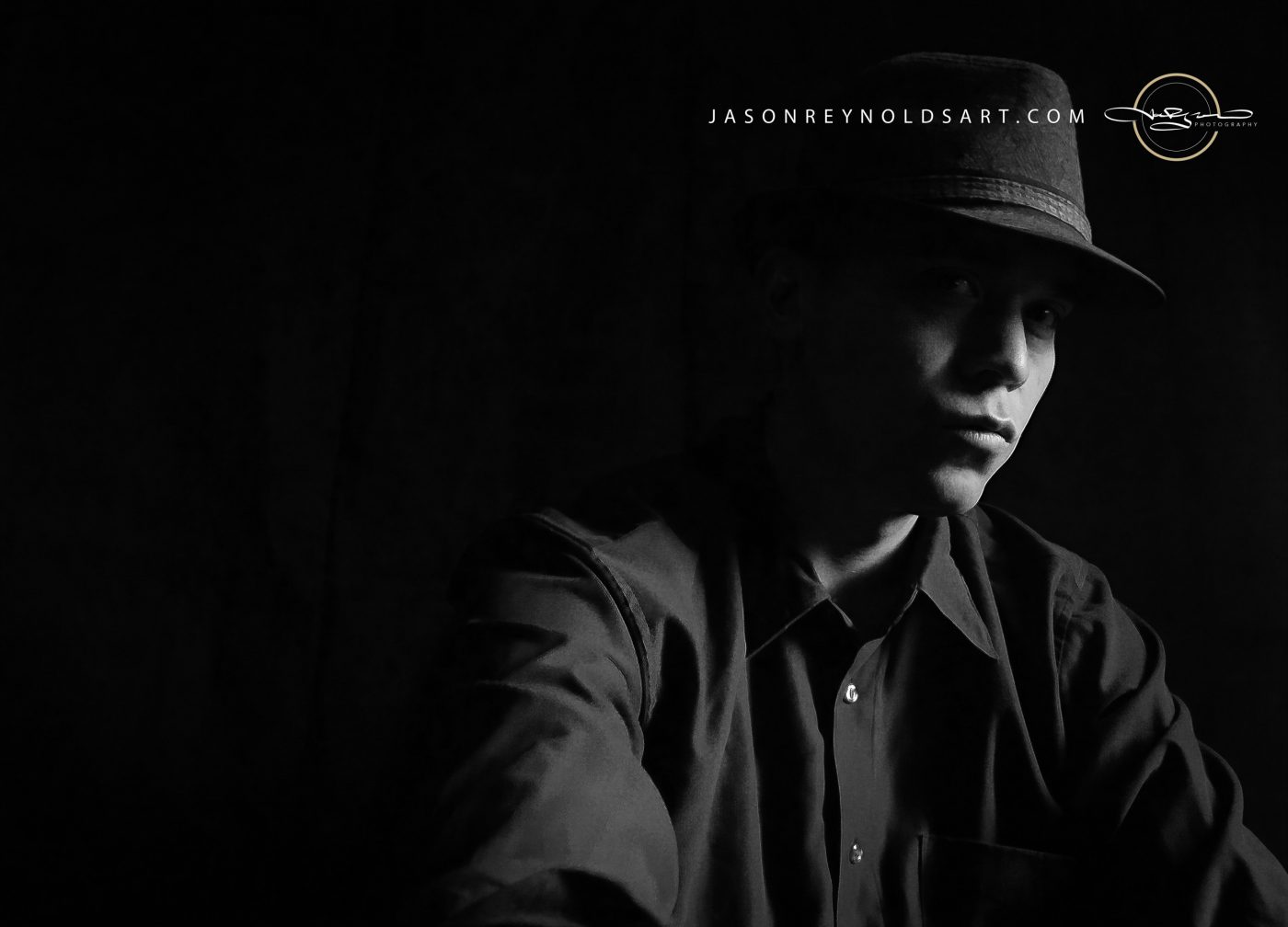 Low-Key Portrait of Man in Fedora