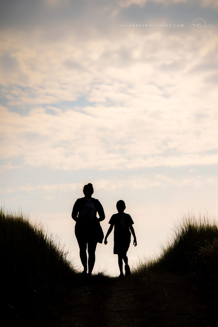 Mother and Son Silhouette on Dune Path