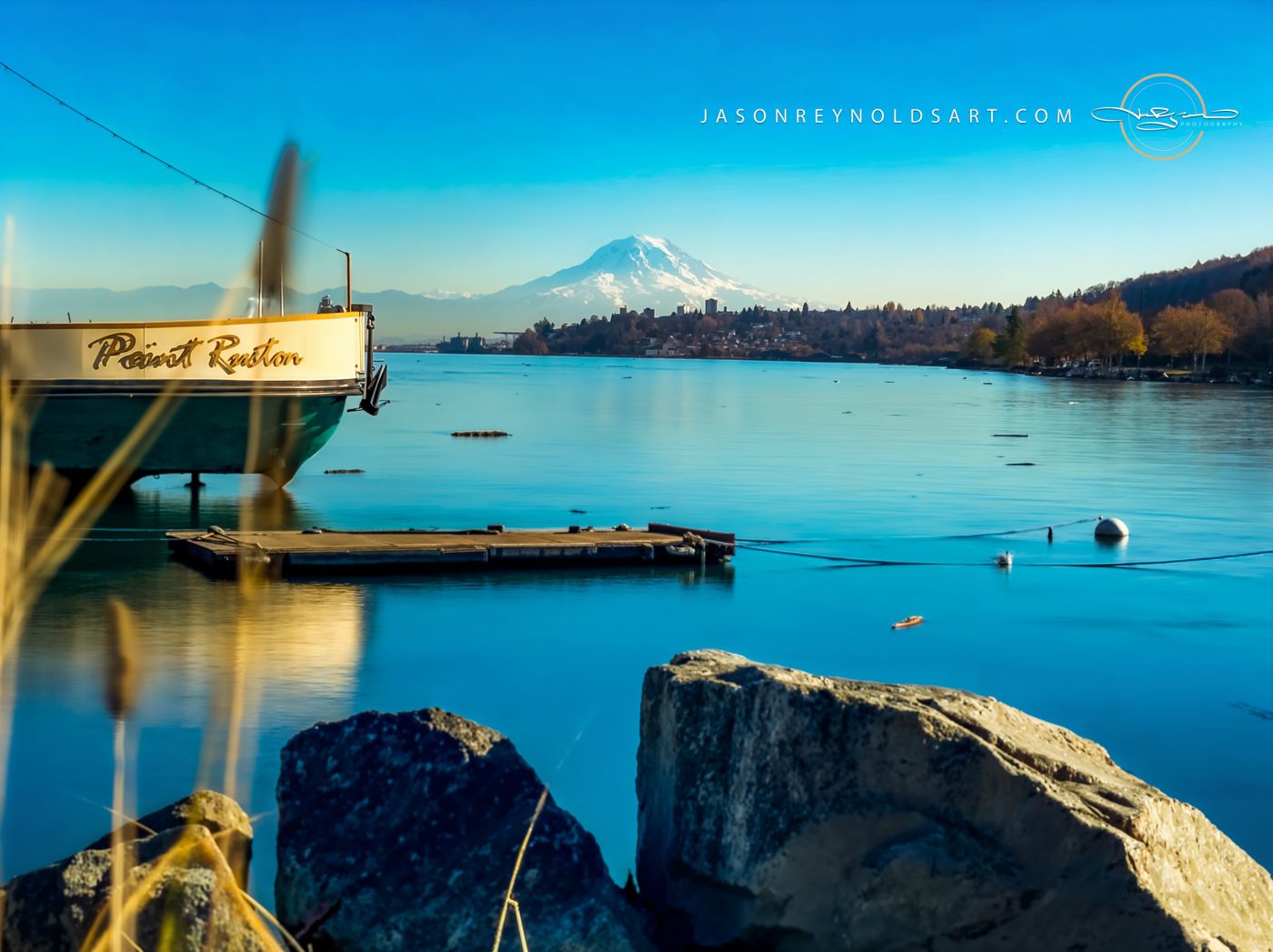 Mount Rainier over calm harbor with dock at Point Ruston