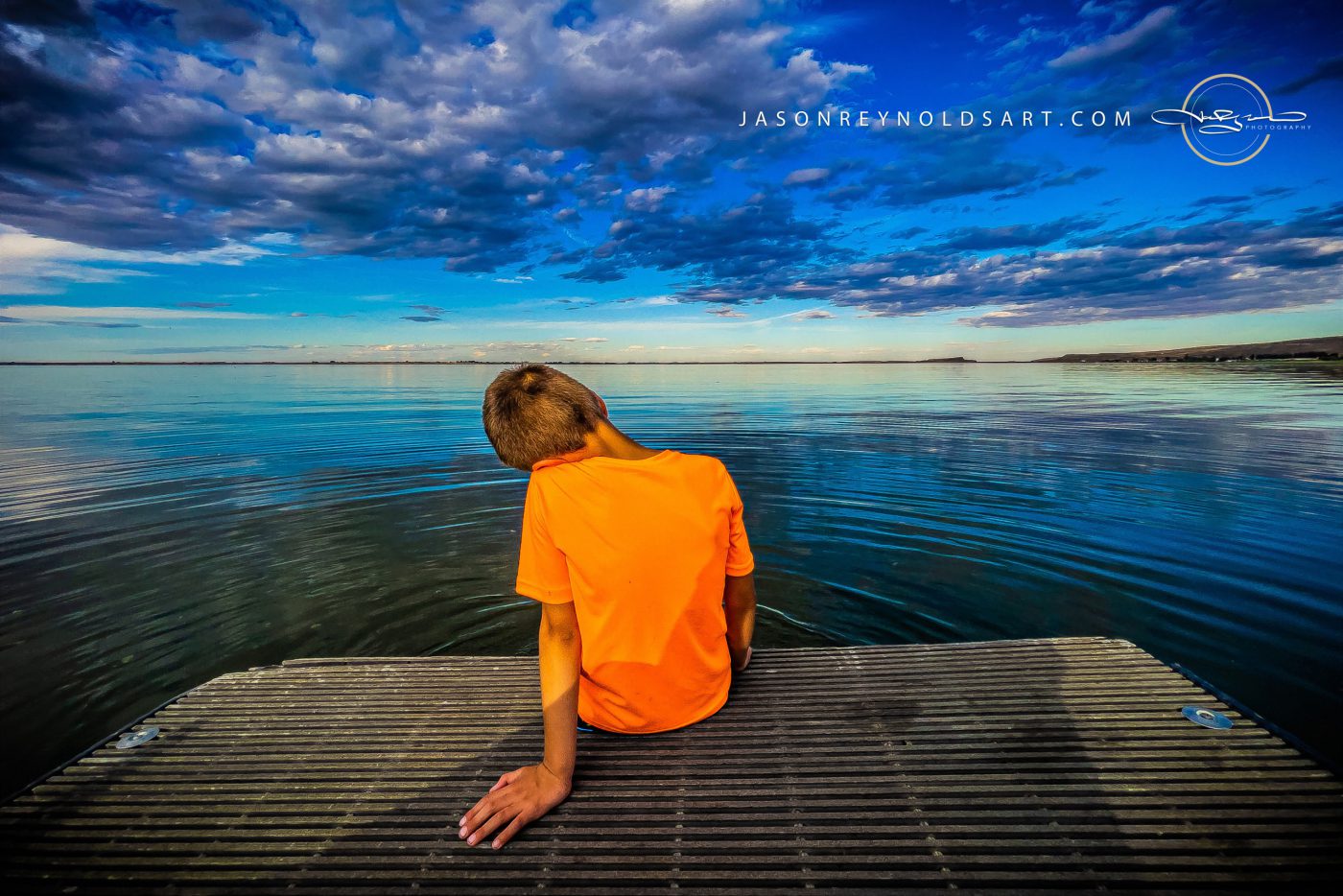 Othello — Boy on a Dock Under a Vast Cloudscape