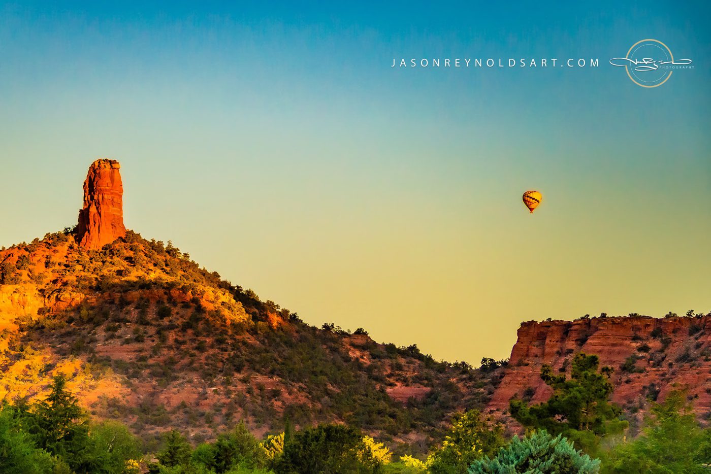 Sedona red-rock spire with hot-air balloon