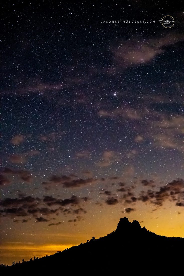 Sedona: Star-Filled Sky Above a Red-Rock Silhouette