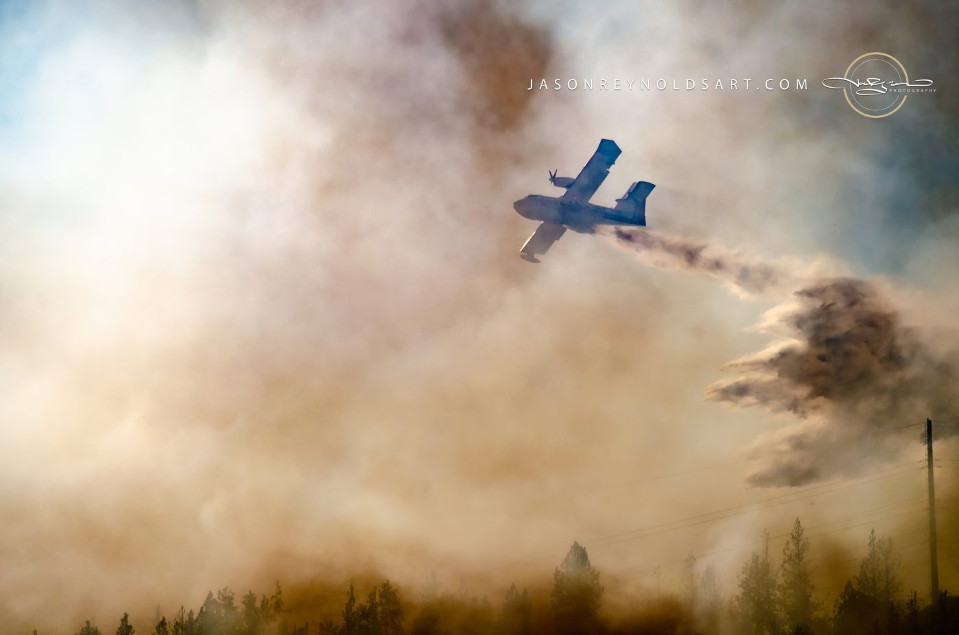 Spokane Valley air tanker dropping water over Millwood smoke