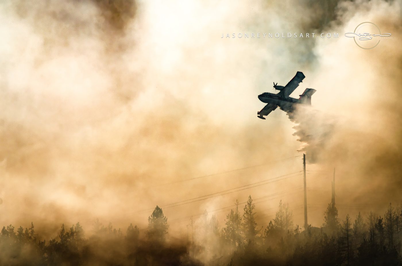 Spokane Valley air tanker dropping water through heavy smoke