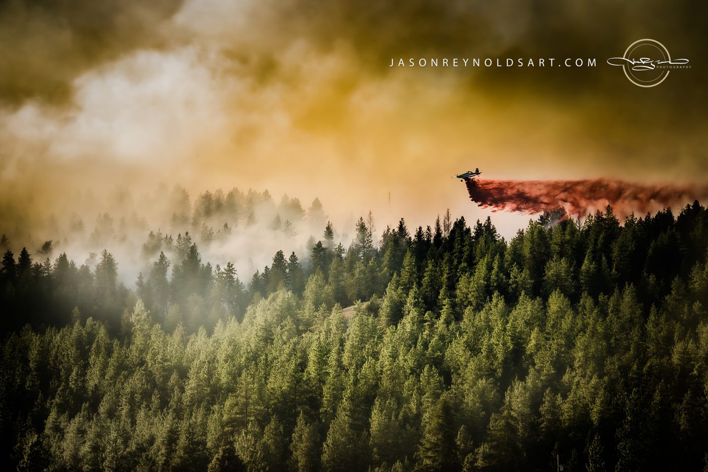 Spokane Valley air tanker drops red retardant over Millwood forest