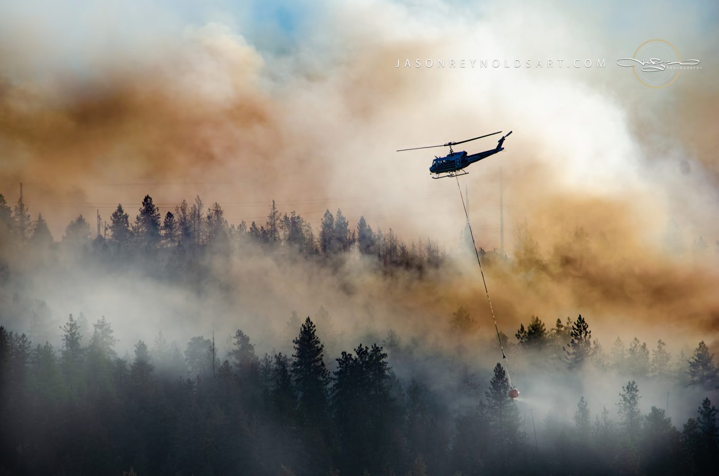 Spokane Valley firefighting helicopter with water bucket