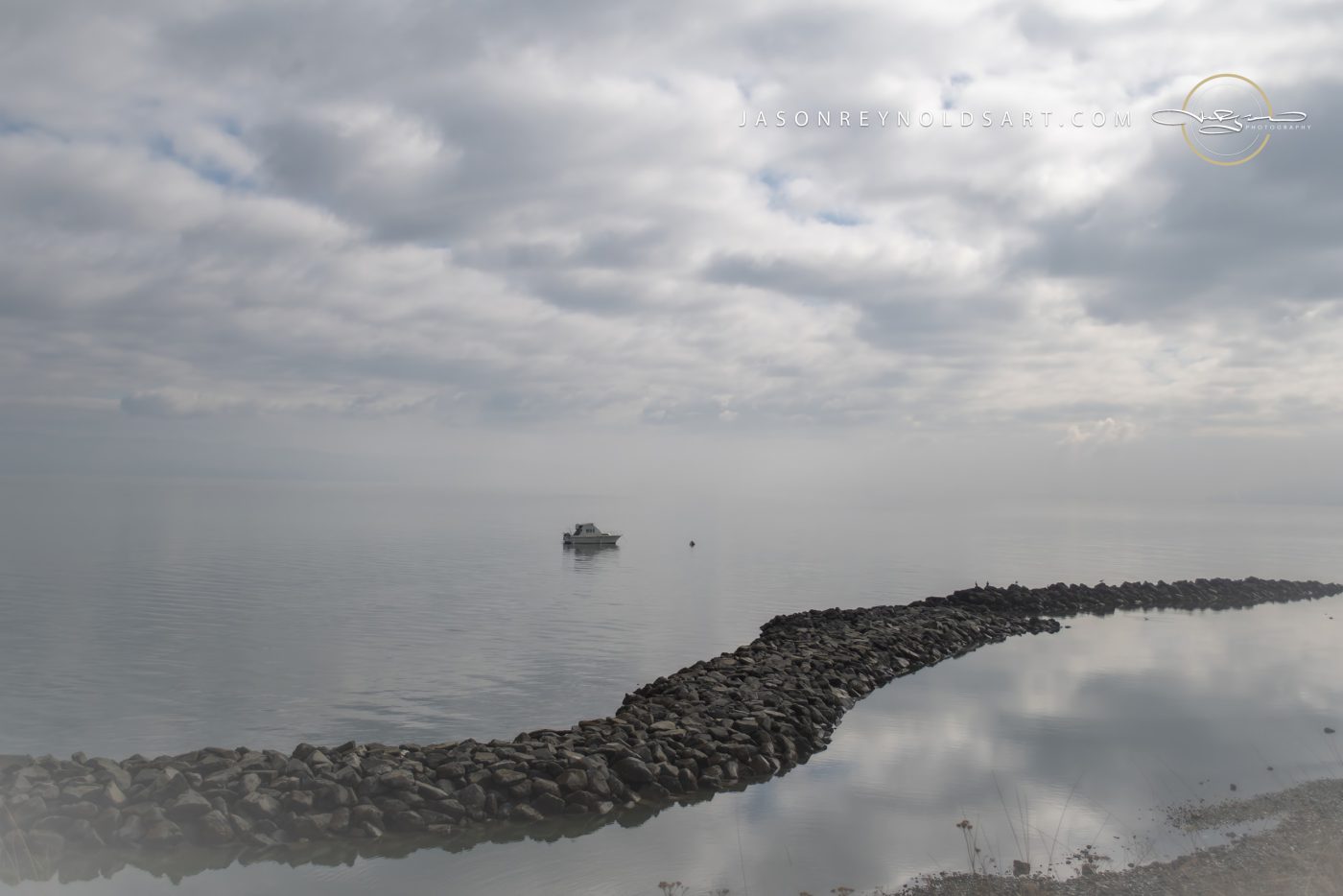 Tacoma — Curving Rock Jetty and Boat at Ruston