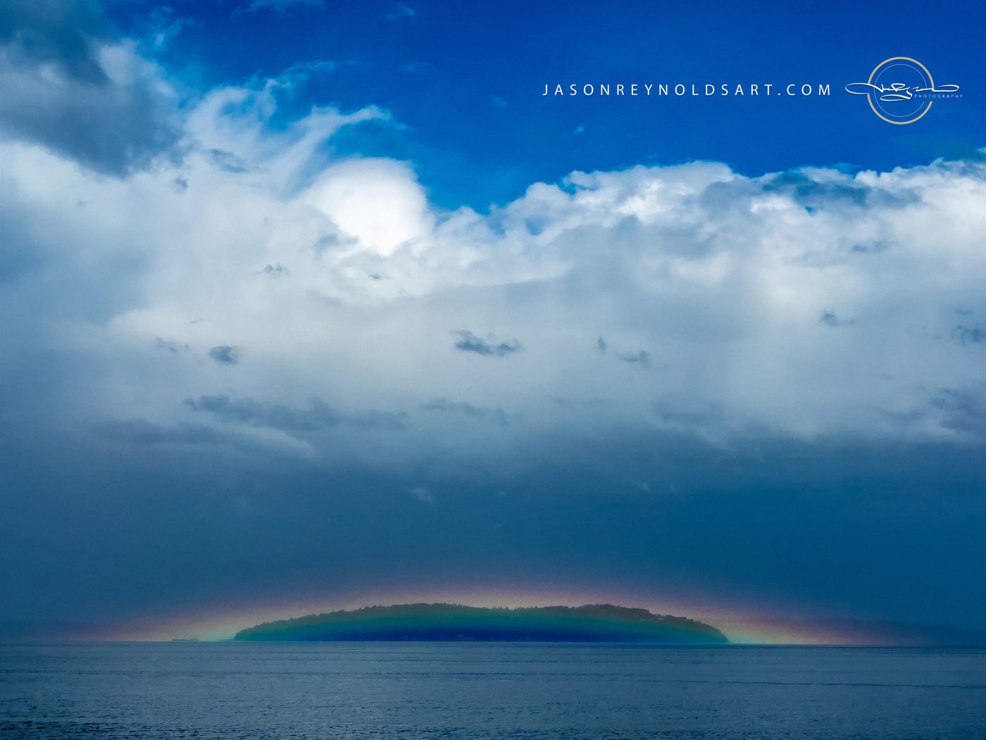 Tacoma — Maury Island Silhouette with Rainbow and Towering Clouds