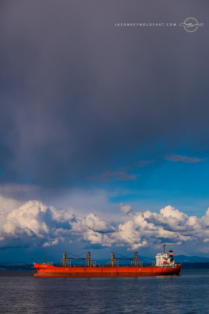 Tacoma — Red Bulk Carrier on Puget Sound under Towering Storm Clouds