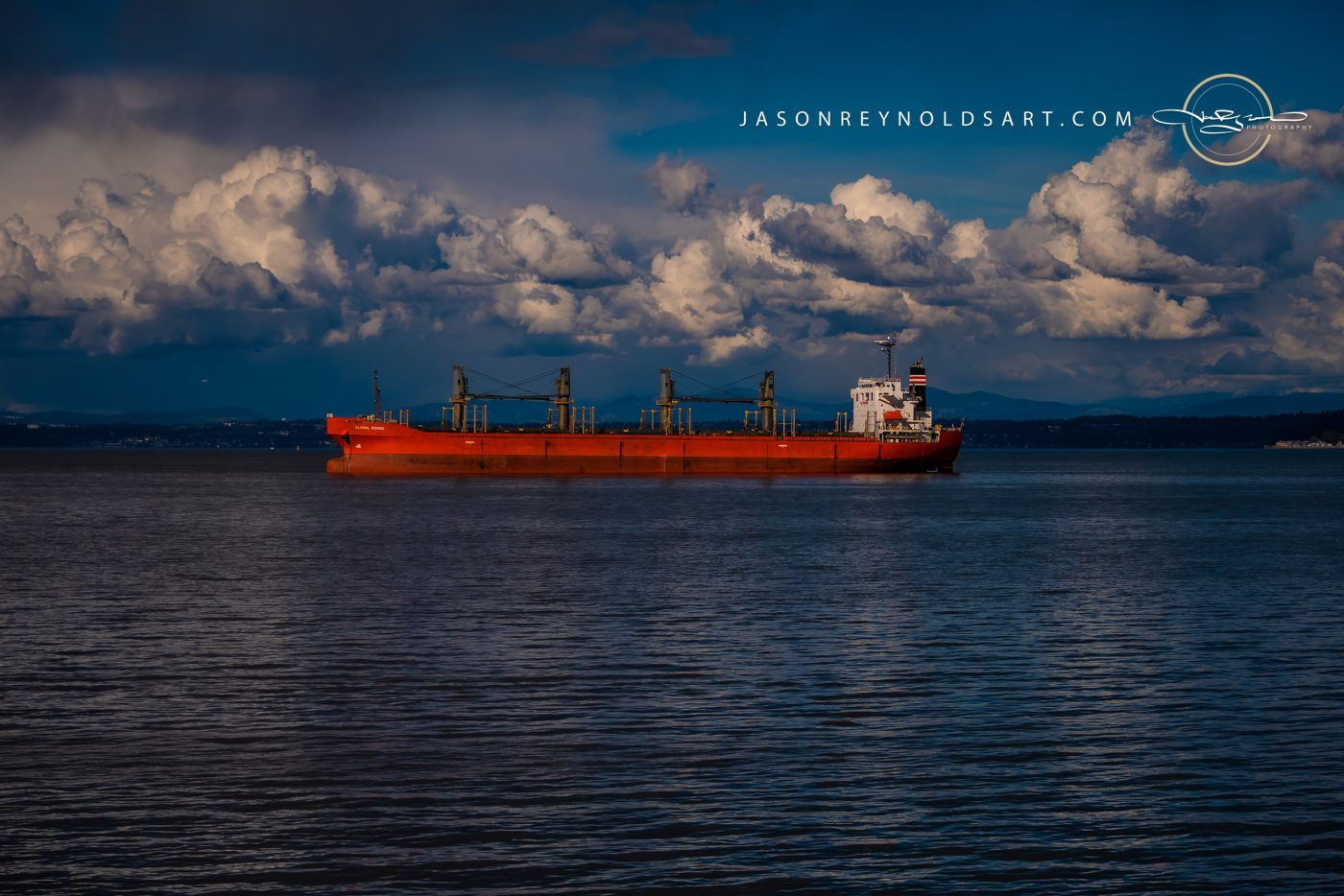 Tacoma: Red Bulk Carrier Under Towering Cumulus Clouds