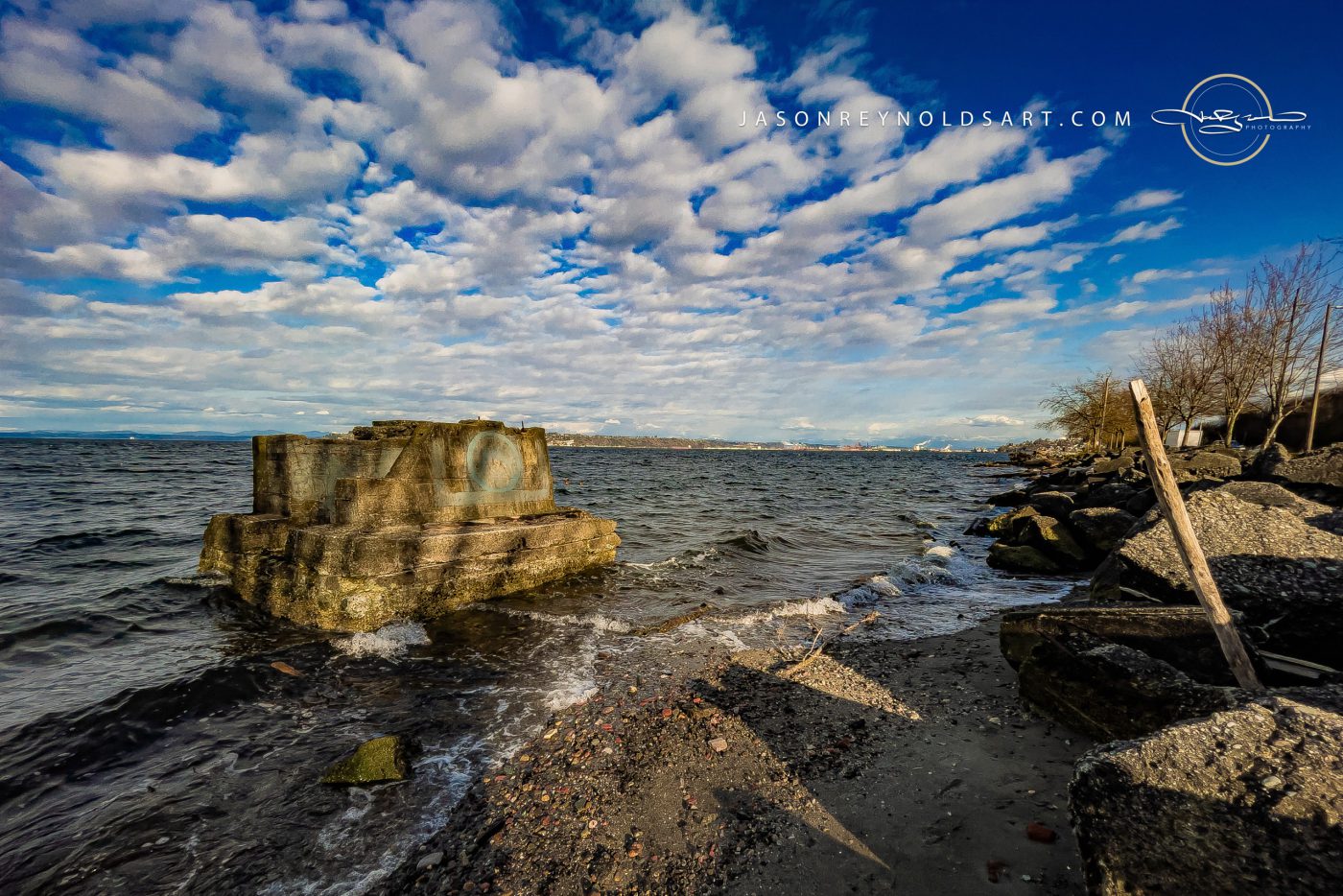 Tacoma Shoreline: Concrete Breakwater and Rolling Clouds