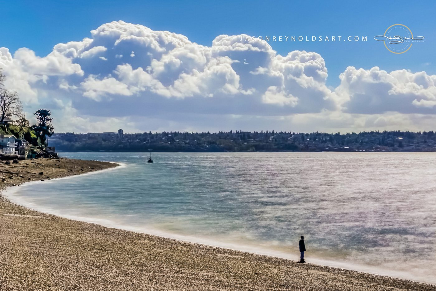 Tacoma shoreline — solitary figure beneath cumulus cloudbank