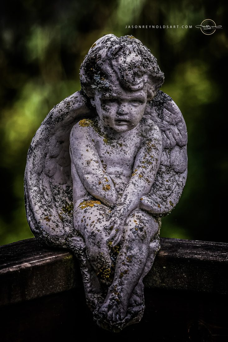 Weathered Cherub Statue